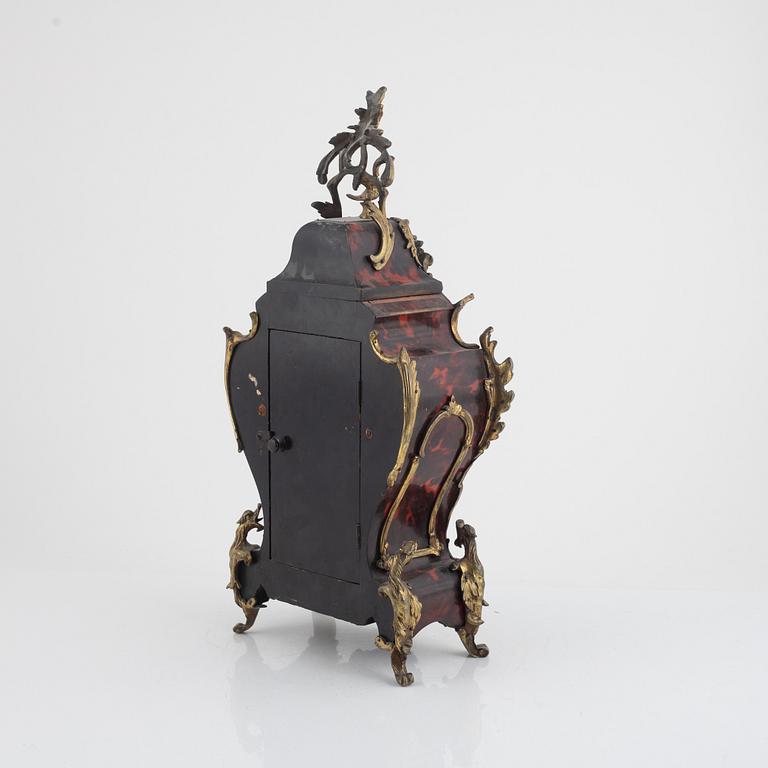 A Louis XV-style 'faux tortoise' and gilt brass-mounted striking mantel clock, late 19th century.