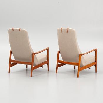 Folke Ohlsson, a pair of "Duxiesta" armchairs with an ottoman, Dux, Sweden, 1960's.