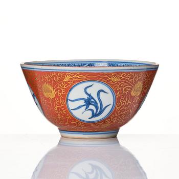 A blue and white bowl with coral red exterior, Japan, 19th century.