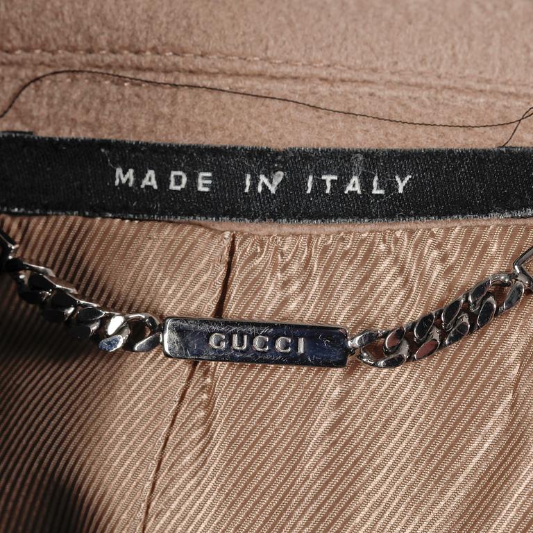 GUCCI, a beige wool and cashmere coat.