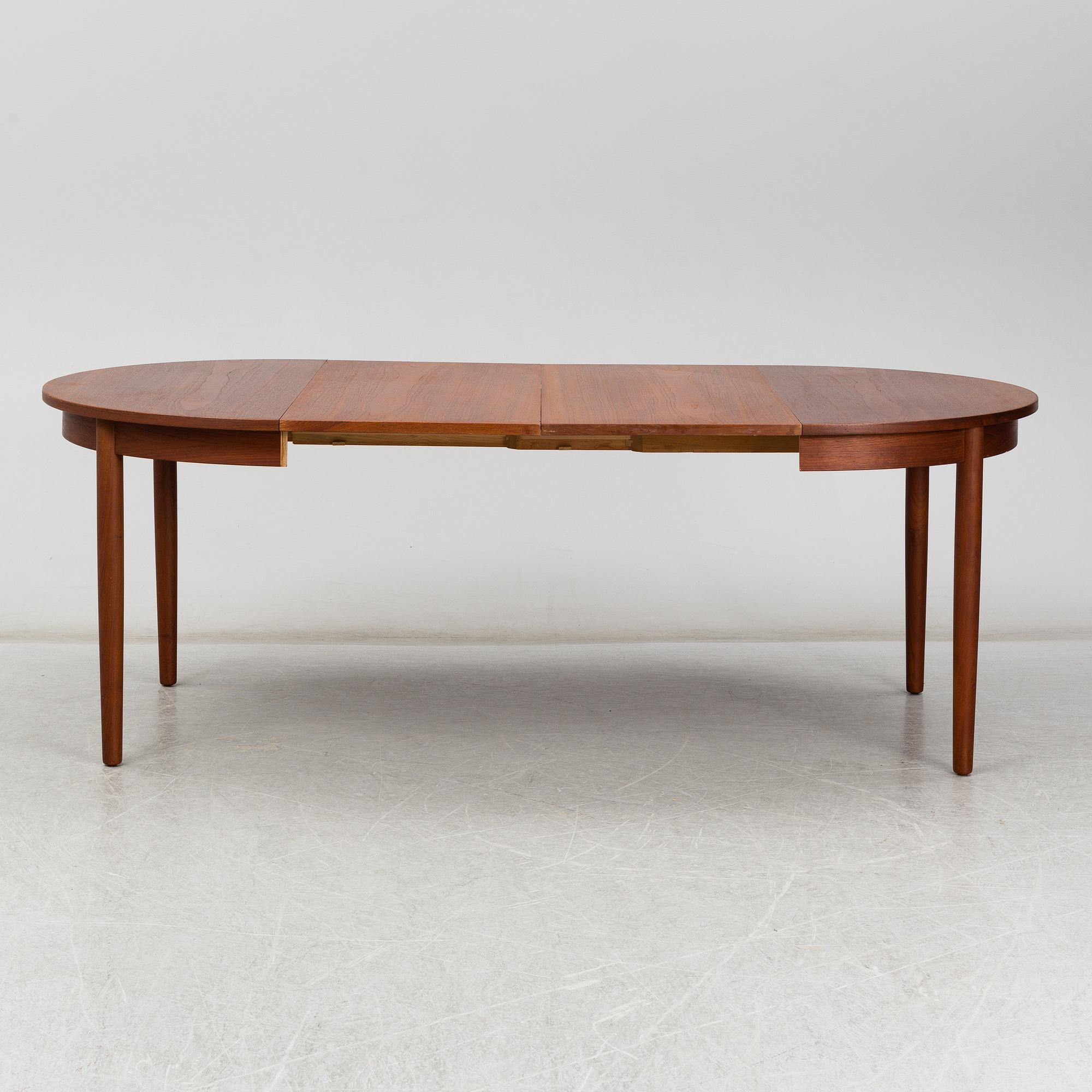 a teak dining table from the second half of the 20th century.