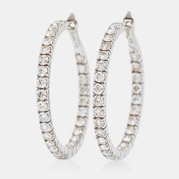1326. A pair of diamond hoop earrings, 2.89 cts in total, according to engraving.
