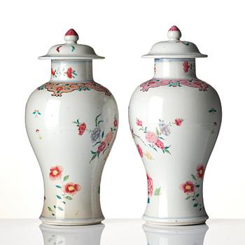 A pair of famille rose rooster vases with covers, Qing dynasty, 18th century.