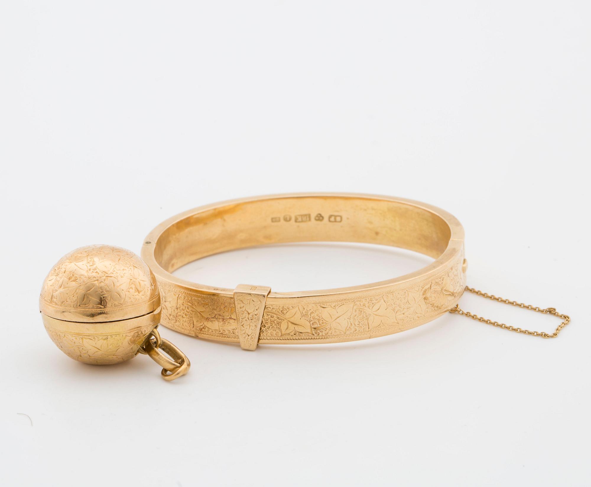 18K gold bracelet with charm.