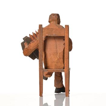 Axel Petersson Döderhultarn, Seated accordionist.