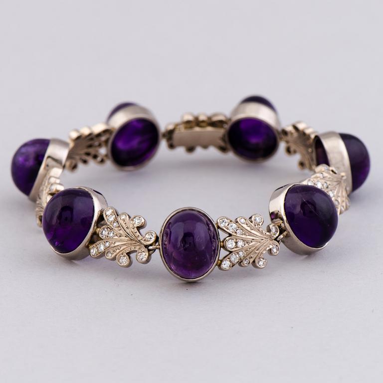 A NECKLACE, BRACELET, EARRINGS and RING, amethysts, diamnonds, 18K white gold and palladium. A. Tillander, 1970s.