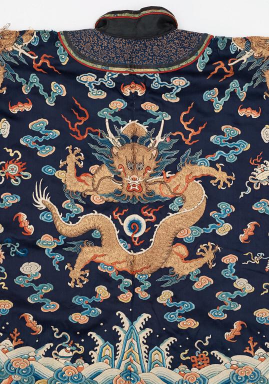 ROBE AND SKIRT, silk. The height of the robe is 64 cm, the height of the skirt 93 cm. China the beginning of the 20th century.