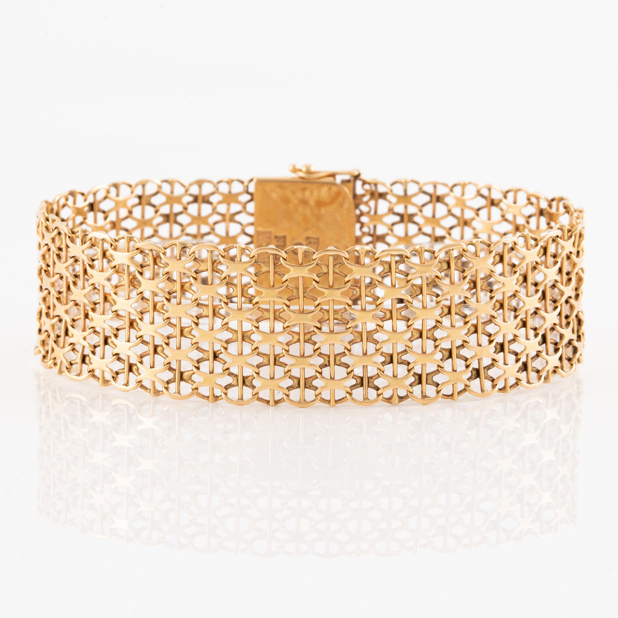 Armlänk, 18K guld, x-länk,  Ädelsmycken  AB, Stockholm 1969.