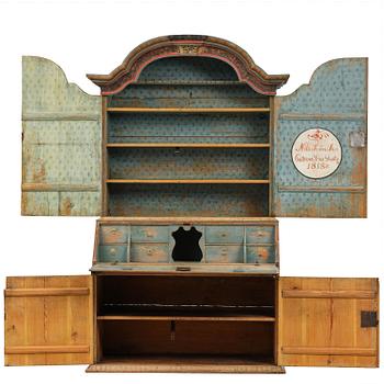A polychrome-painted folk art cabinet from Värmland, Sweden, dated 1818.