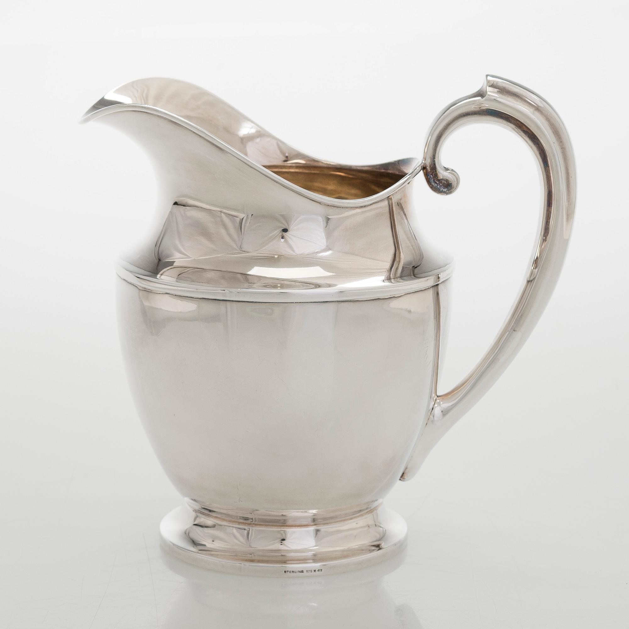A sterling silver jug, Ellis Bros England.