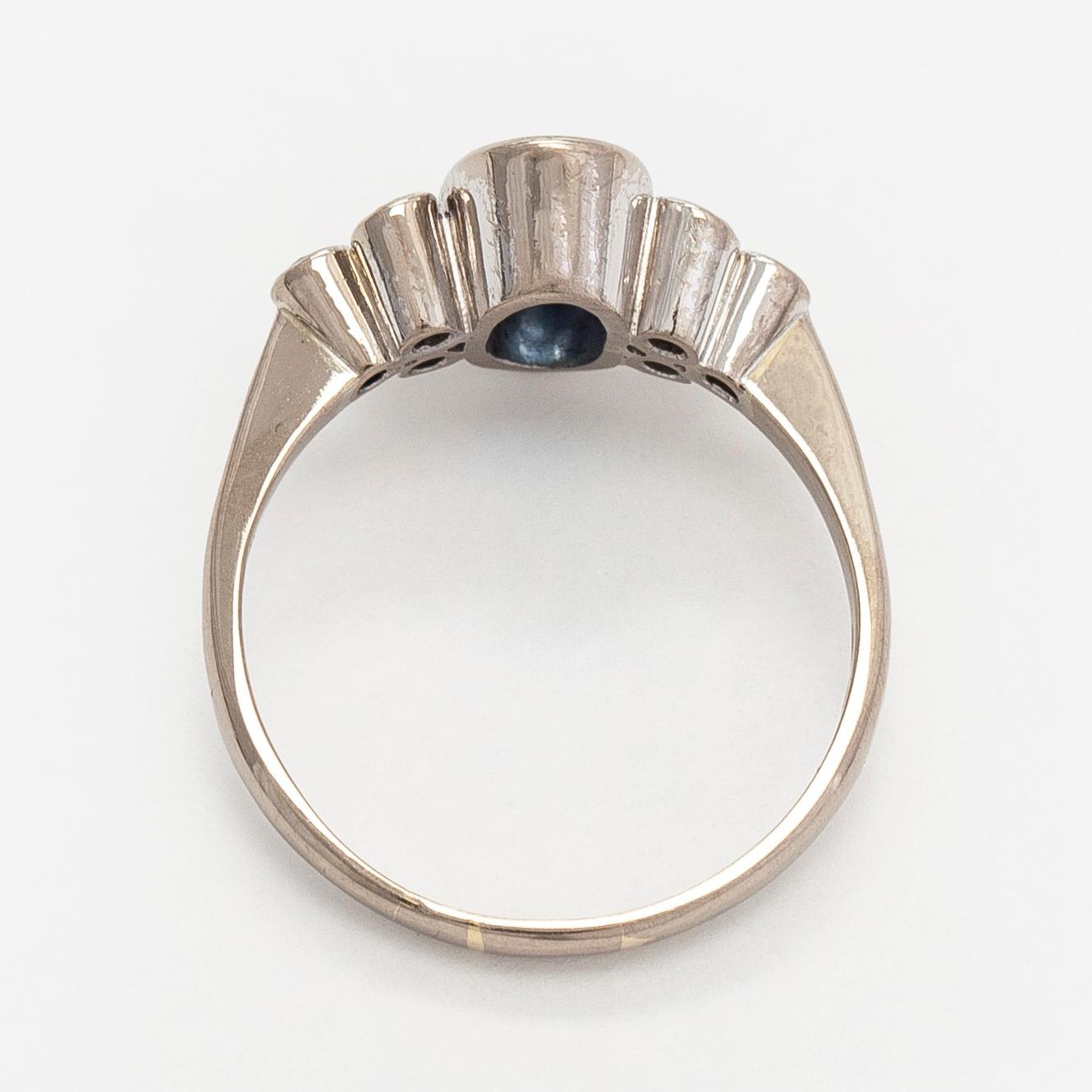 A. Tillander, ring, faceted sapphire, brilliant cut diamonds, 18K white gold, Helsinki 1983.