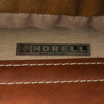 AN ARNE NORELL "INCA" LOUNGE CHAIR.