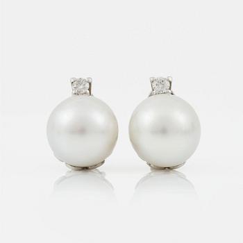 1215. A pair of cultured South sea pearl and diamond earrings. Total carat weight of diamonds circa 0.35 ct.