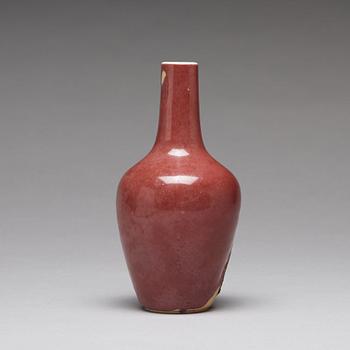 A sang de boef vase and bowl and an enamelled cup with cover and stand, Qing dynasty (1664-1912).