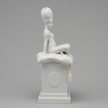 A white glazed Royal Copenhagen porcelain nodding head figure, Denmark, early 20th Century. Not first quality.