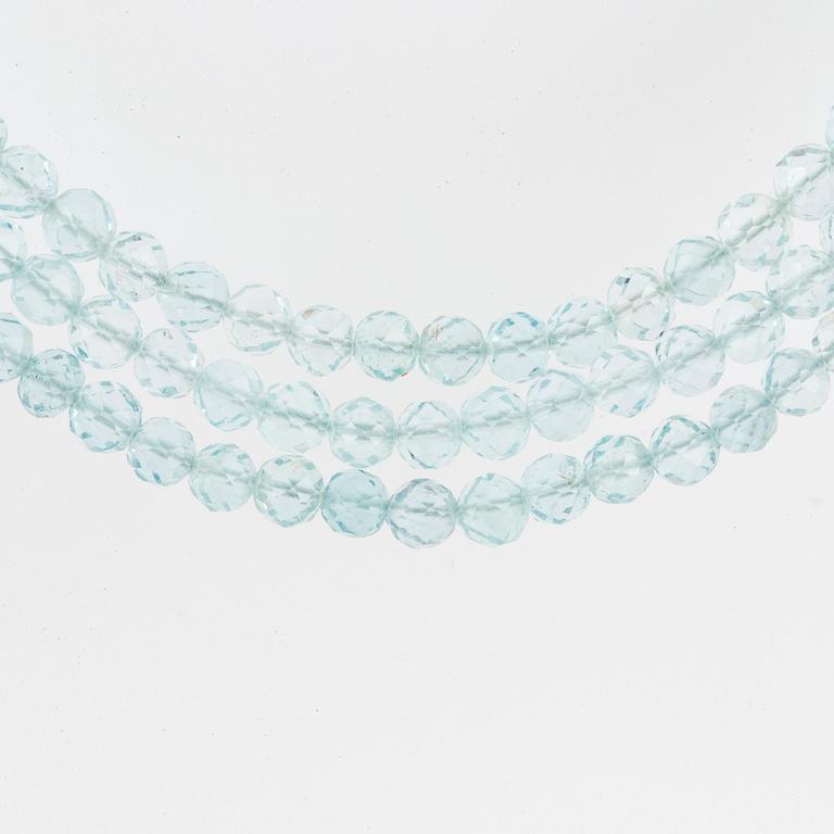 A Tiffany & Co three strand faceted aquamarine bead necklace with an 18K white gold clasp.
