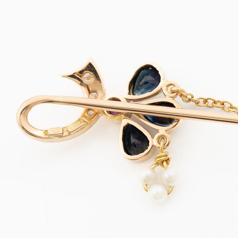 Lapel pin, 18K gold with brilliant-cut diamonds, sapphires, a ruby and pearls.