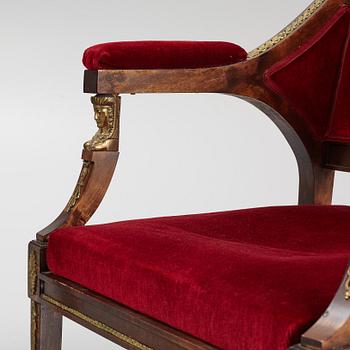 A pair of Empire style armchairs, first half of the 20th century.