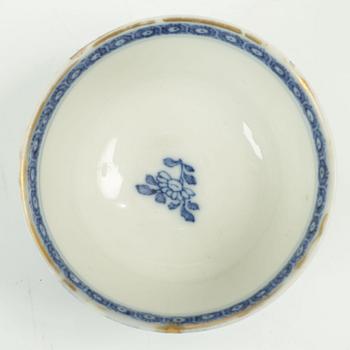 A Chinese soft paste cup with saucer, Qing dynasty, 18th century.