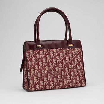 CHRISTIAN DIOR, a red monogram canvas handbag.