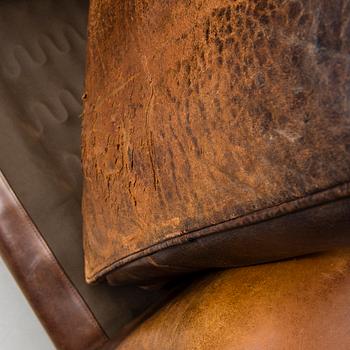 A Chesterfield style armchair from the latter part of the 20th century.