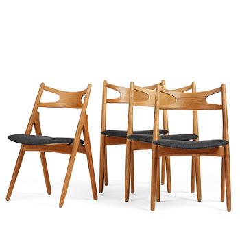Hans J. Wegner, a set of four "Savbukkestolen" chairs, Carl Hansen & Son, Denmark, 1950s-60s.