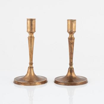 A pair of bronze candlesticks, 18th Century.