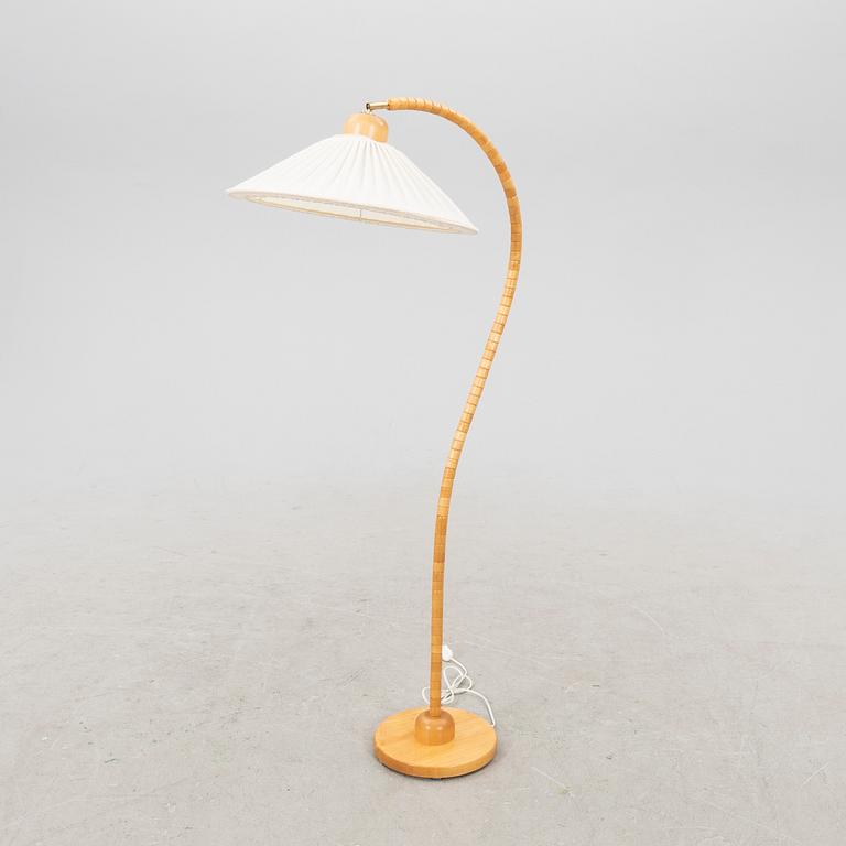 A Markslöjd 21st century wooden floor lamp.