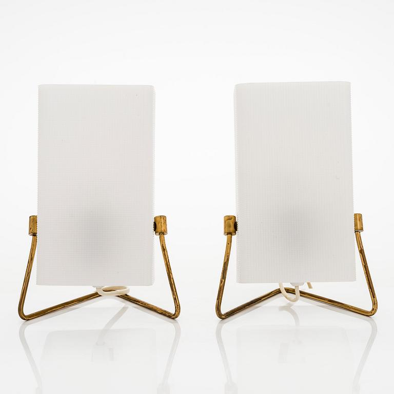 A pair of mid-20th century brass and acrylic table lights, model PS4, Korumo/Hyval, Finland.