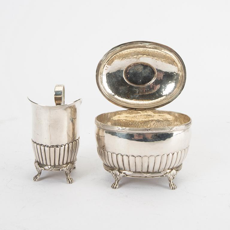 A 20th century silver creamer and sugar bowl weight 310 grams.