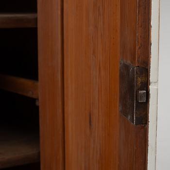 A two-part corner cabinet, 19th century.