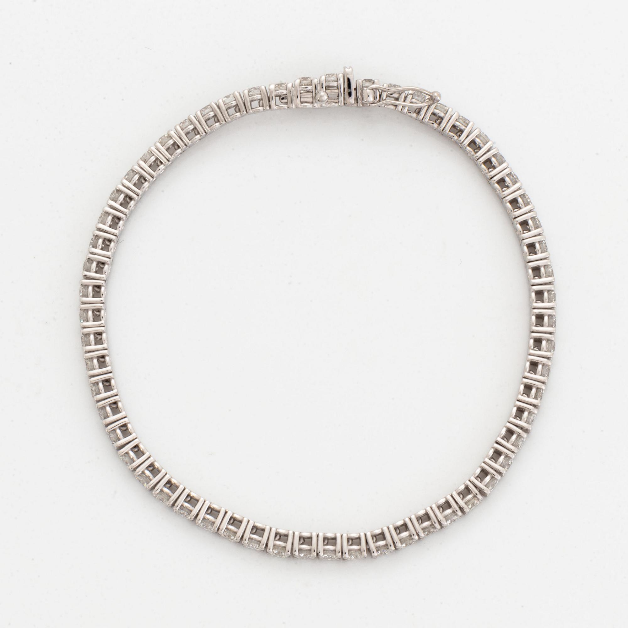 Brilliant-cut diamond tennis bracelet, with report HRD.