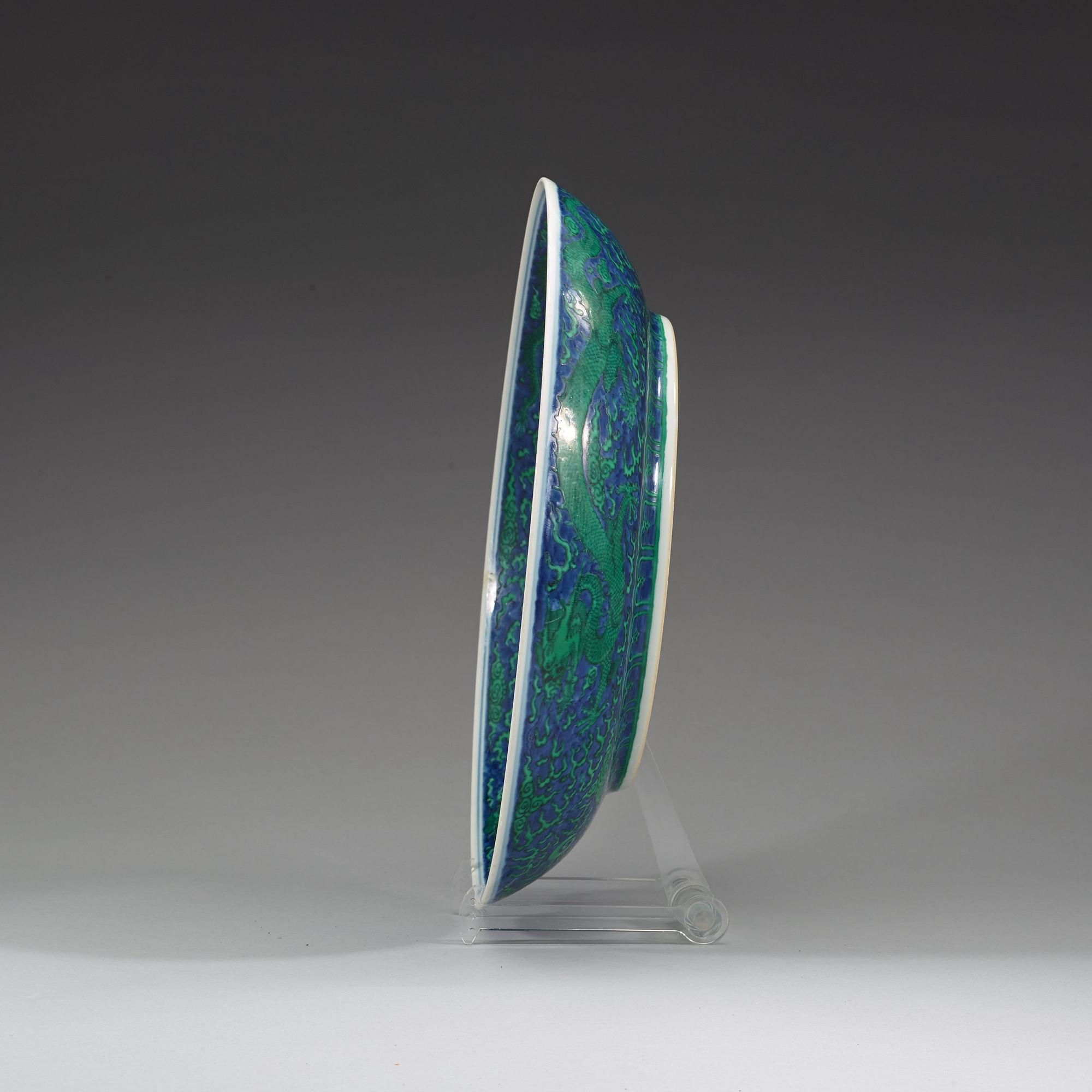A large green enamelled blue and white dragon dish, probably late Qing dynasty with Kangxi's six character mark.