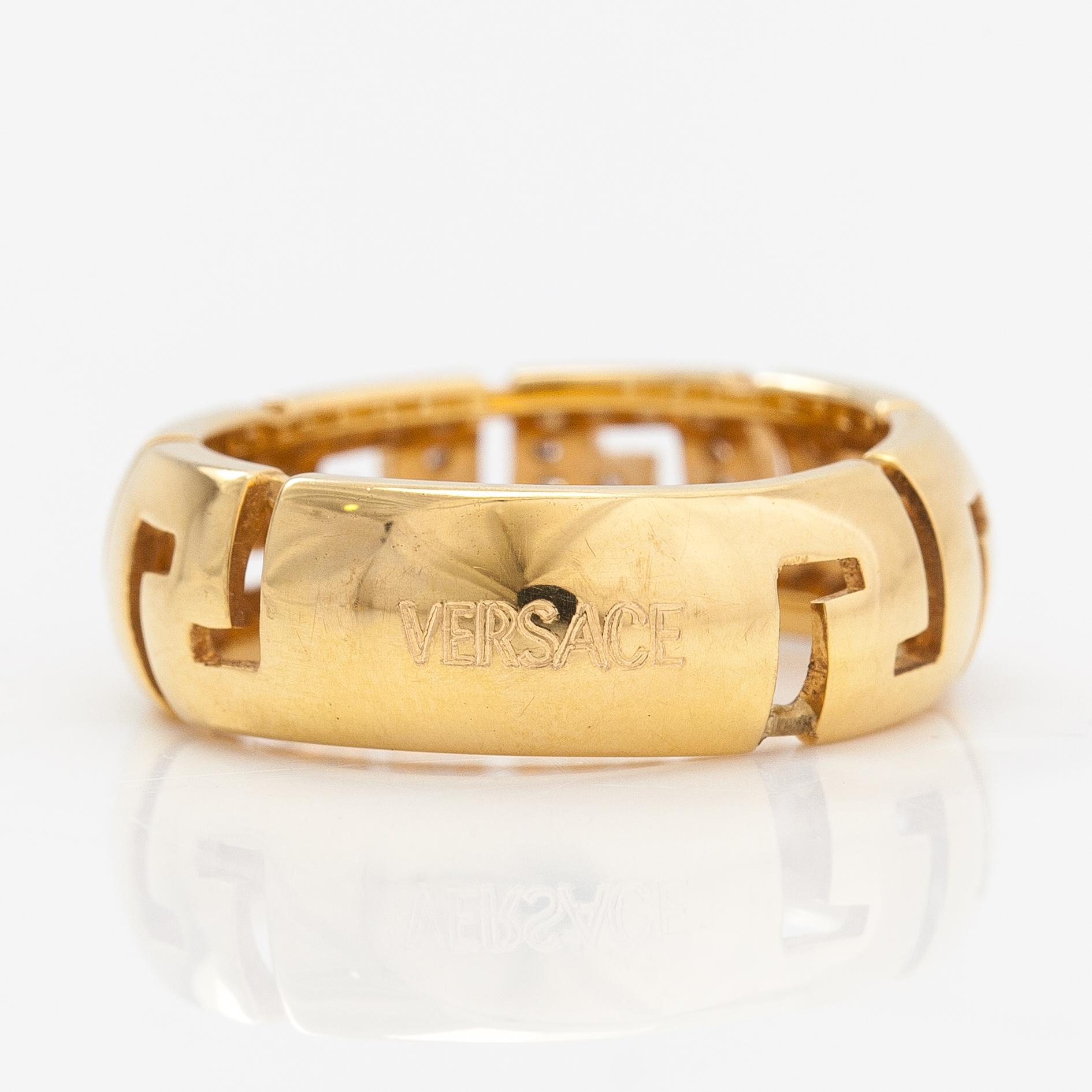 Versace An 18K gold ring with diamonds ca. 0.12 ct in total. Marked Versace. Bukowskis