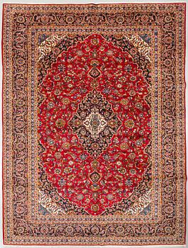 A Keshan rug, signed, 410 x 295 cm.