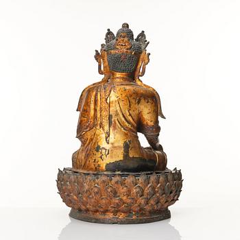 A large cold gilt sculpture of a crowned medicine Buddha/Bhaisjyaguru, Ming dynasty (1368-1644).