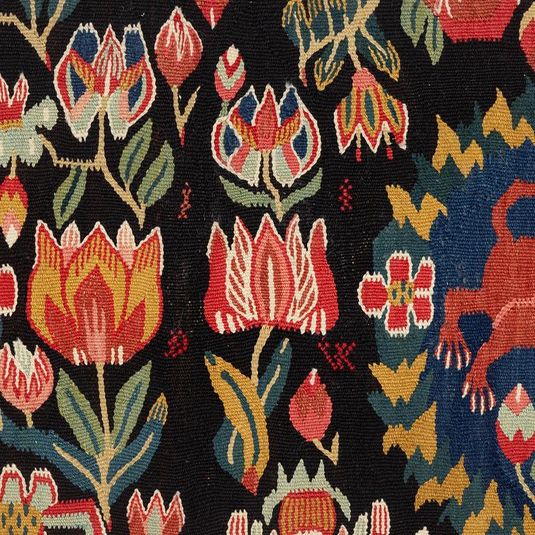 A cushion, 'Red Lion' (Rött Lejon), tapestry weave, c. 102 x 46cm, southwestern Scania, first part of the 19th century.