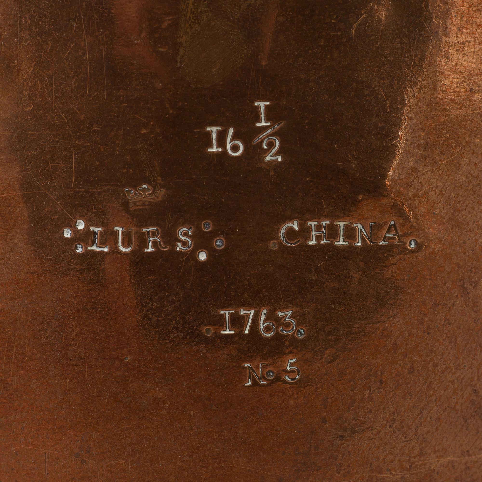 A 18th century copper cauldron.