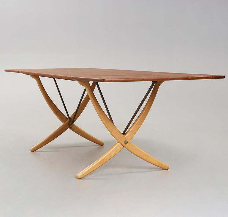 A Hans J Wegner teak and beech dinner table by Andreas Tuck, Denmark 1950-60's.