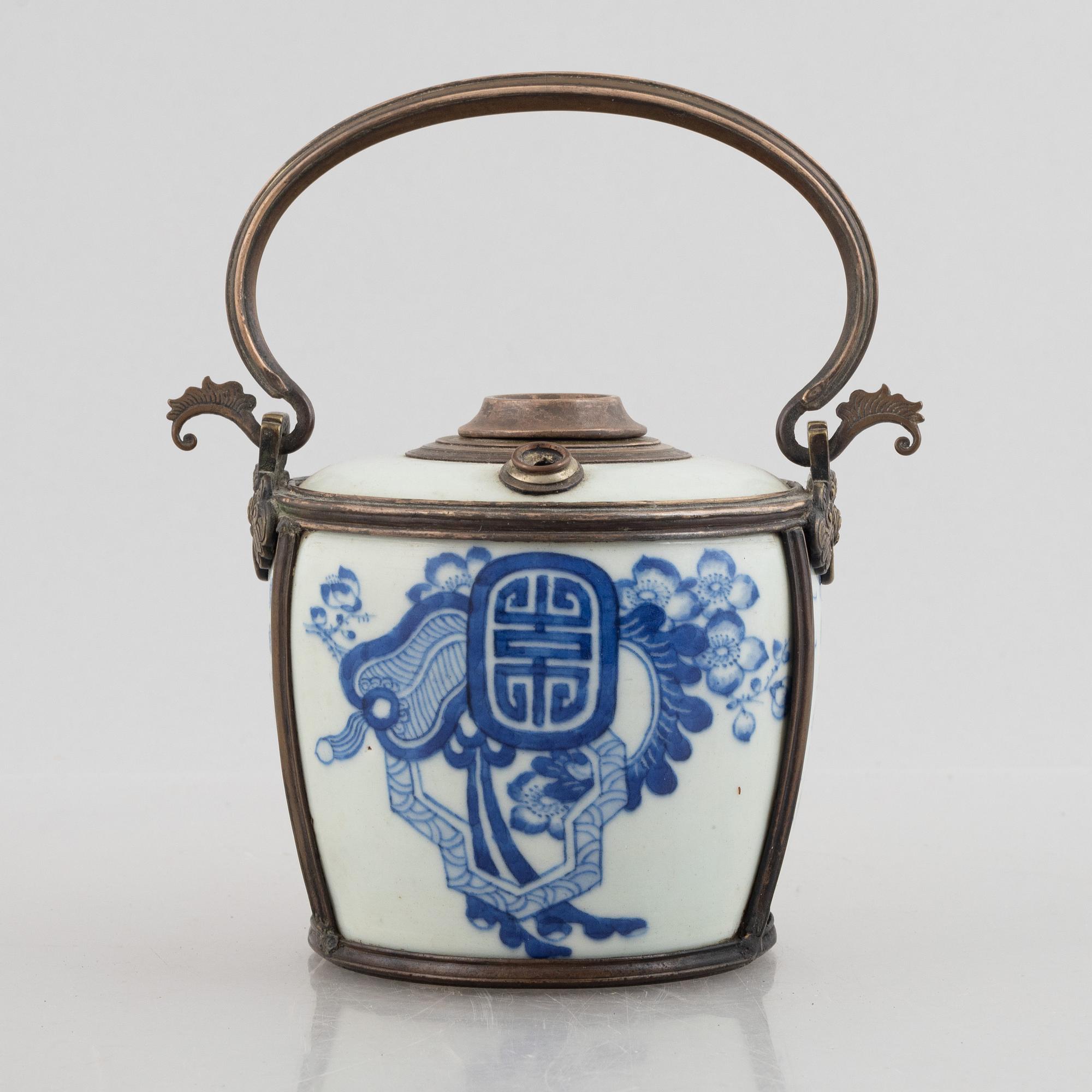 A metal mounted porcelain ewer, late Qing dynasty.