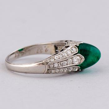 A RING, cabochon cut emerald, old cut diamonds. Alexander Tillander, St Petersburg 1855-1918.