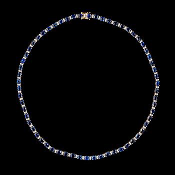 1193. A blue sapphire and diamond necklace, tot. app. 1.30 cts.