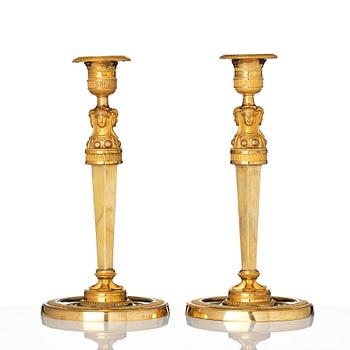 A pair of French Empire candlesticks, early 19th century.