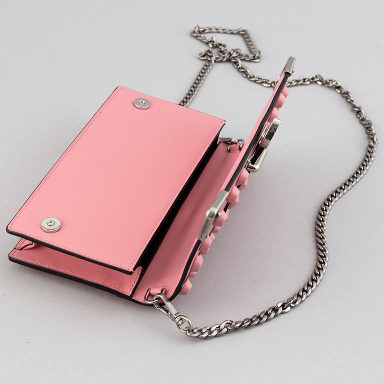 A Prada leather mini bag " Cahier" with metal details and rivets. Marked "Prada Milano". Authenticity card included.