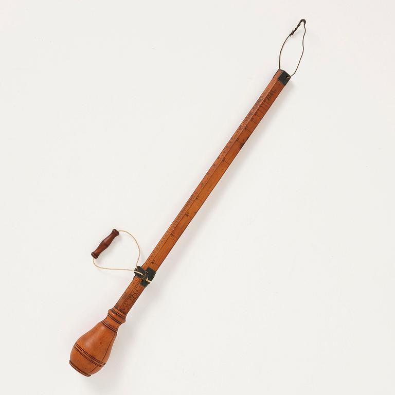 A wooden steelyard balance by N. Lind (manufacturer of instruments in Stockholm third quarter 18th century - 1798), 1765.