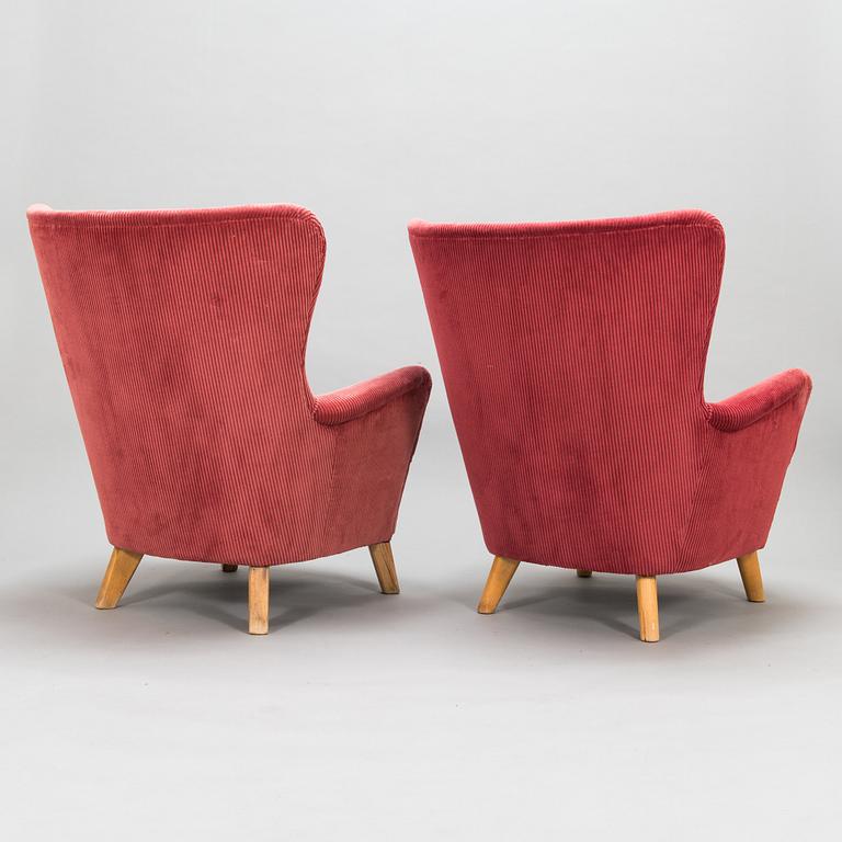 A pair of mid-20th-century armchairs.