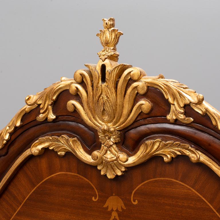 a set of a mahogany veneered and guilded rococo-style bed and two bedside tables.