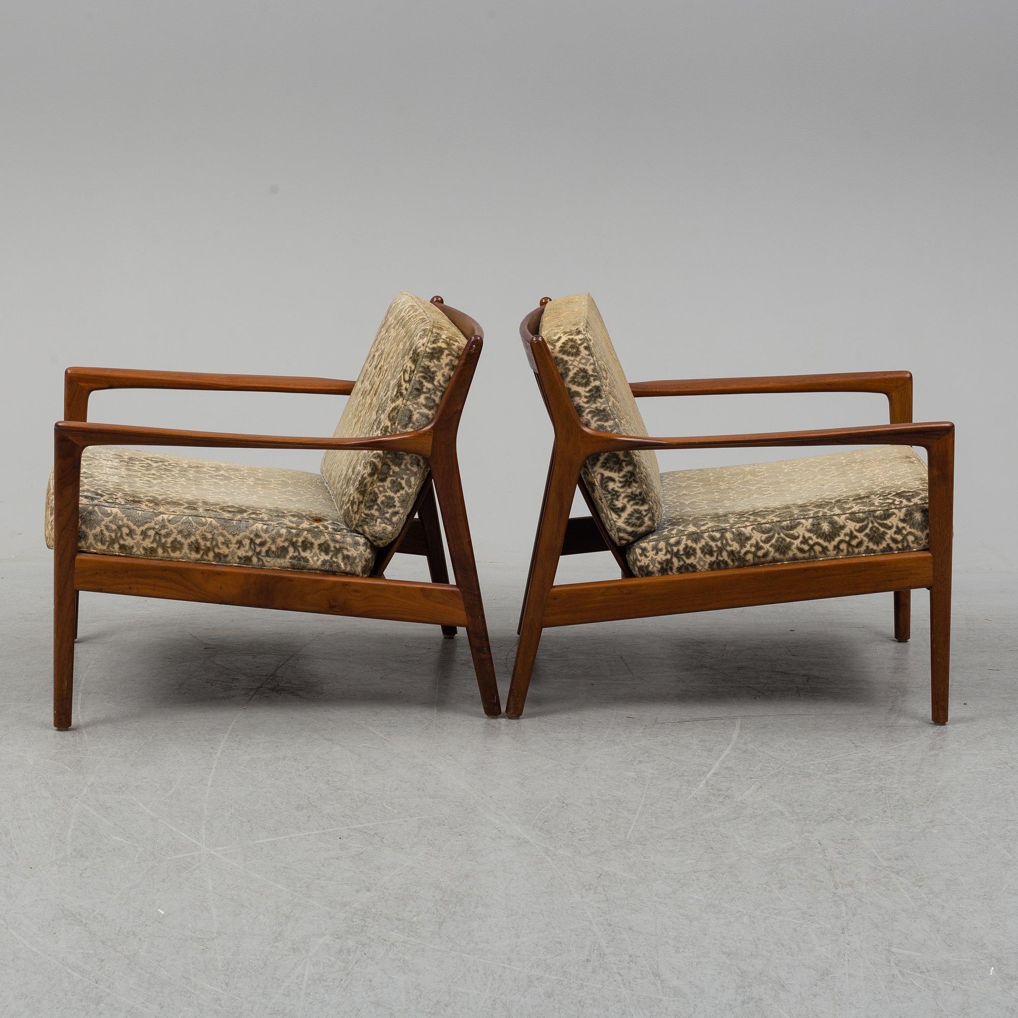 A pair of 'USA 75' teak easy chairs by Folke Ohlsson for Dux.