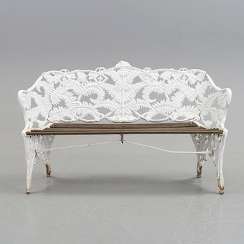 A WHITEPAINTED EARLY 20TH CENTURY SWEDISH AGGENBERG CAST IRON AND WOOD GARDEN SOFA.