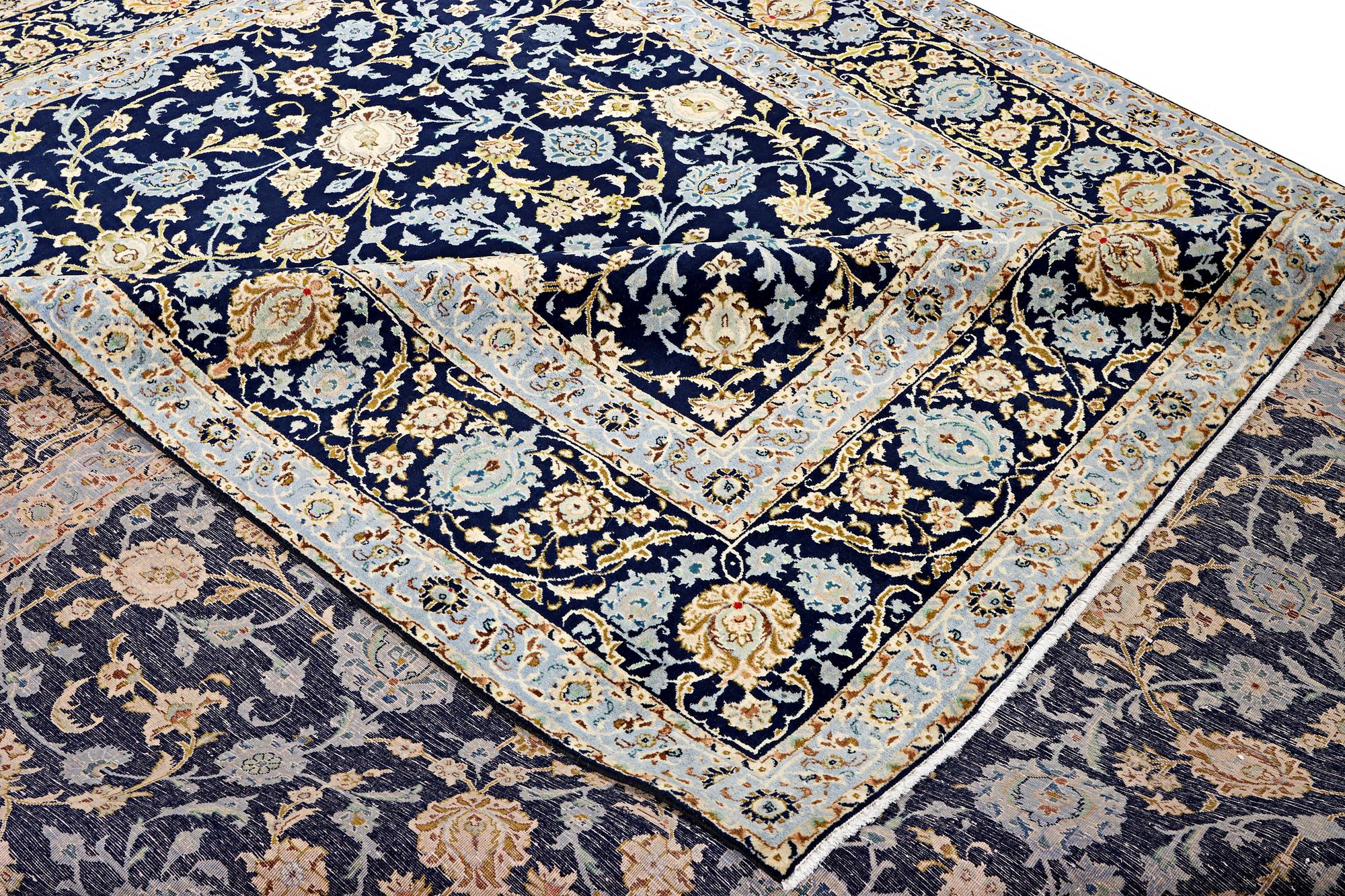 A Kashan carpet, c. 395 x 305 cm.